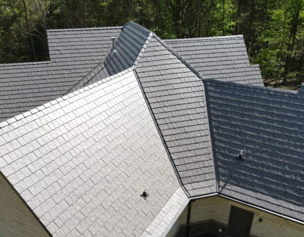 {Aerial photo of a home with ProVia Larkstone Slate metal roofing}
