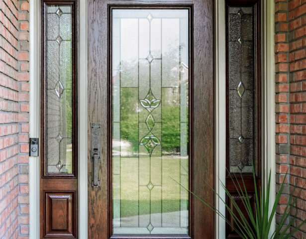 {Signet® Oak 460 style entry door with a medium brown custom stain and Esmond Decorative Glass}