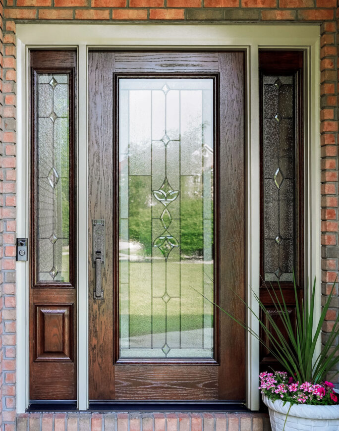 {Signet® Oak 460 style entry door with a medium brown custom stain and Esmond Decorative Glass}