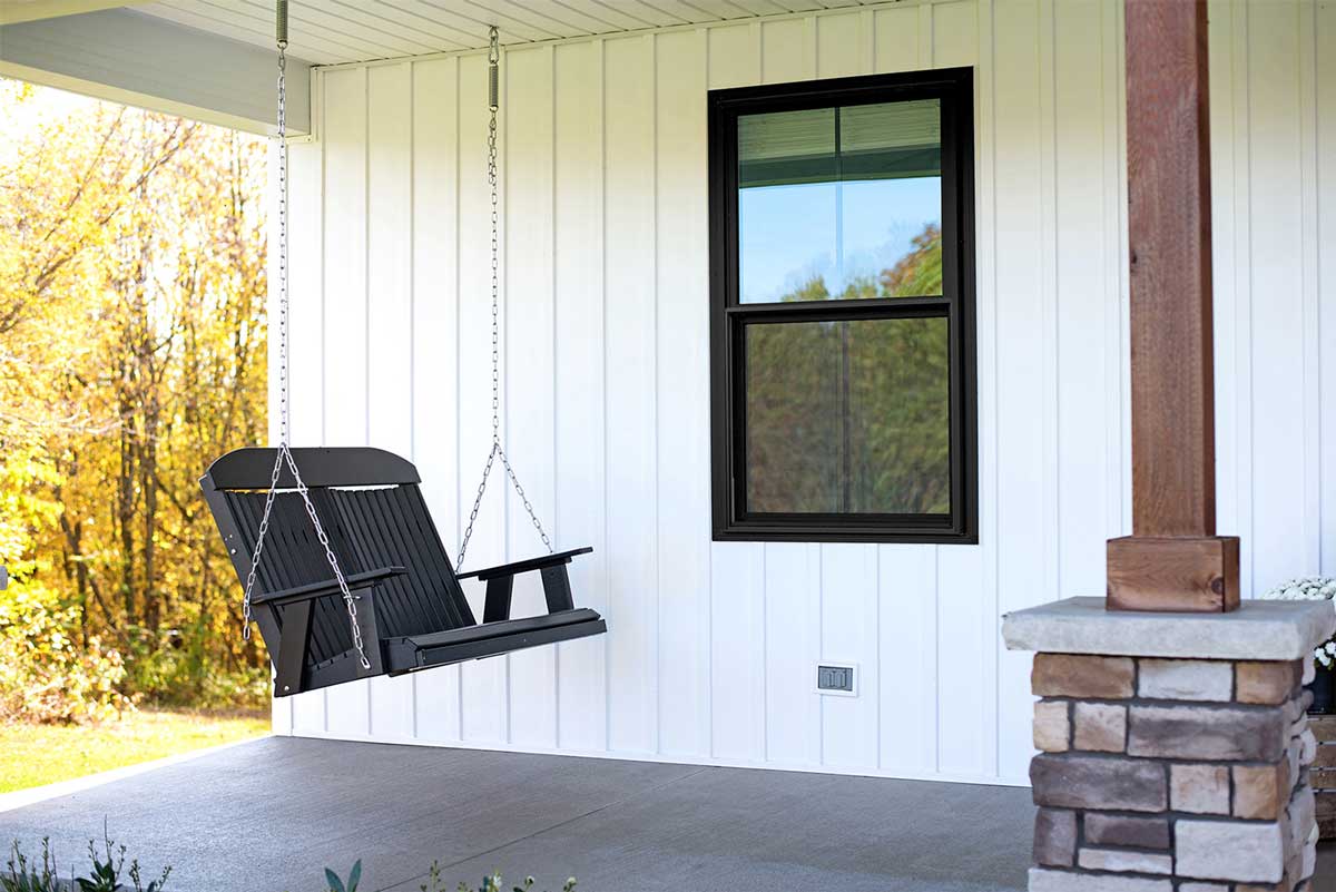 White Board 'n Batten on a porch with a porch swing