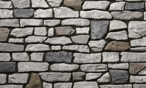 {Gray and brown manufactured stone veneer with brown grout, Ridge Cut™ Denali profile}