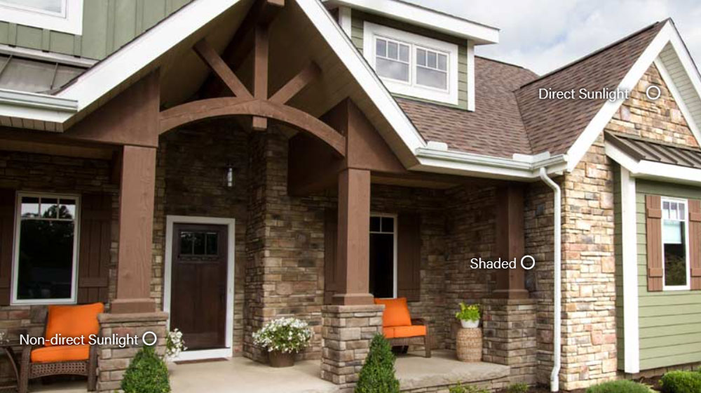 Image of a home with stone veneer demonstrating how outdoor lighting conditions affects stone color