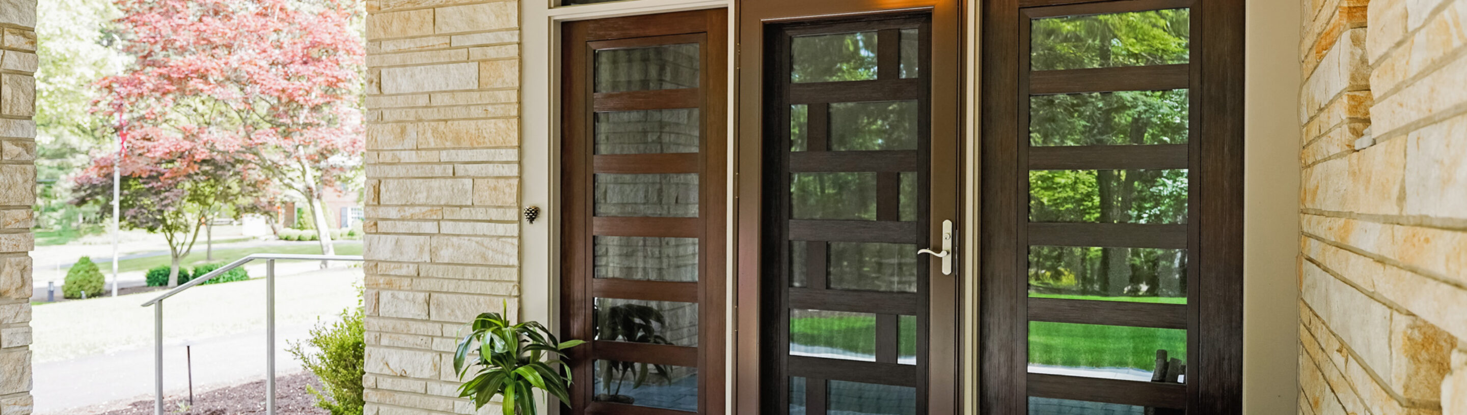{A ProVia Deluxe™ Full View 397 Storm Door in Tudor Brown on a modern-style home}