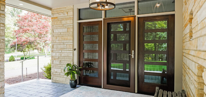 {A ProVia Deluxe™ Full View 397 Storm Door in Tudor Brown on a modern-style home}