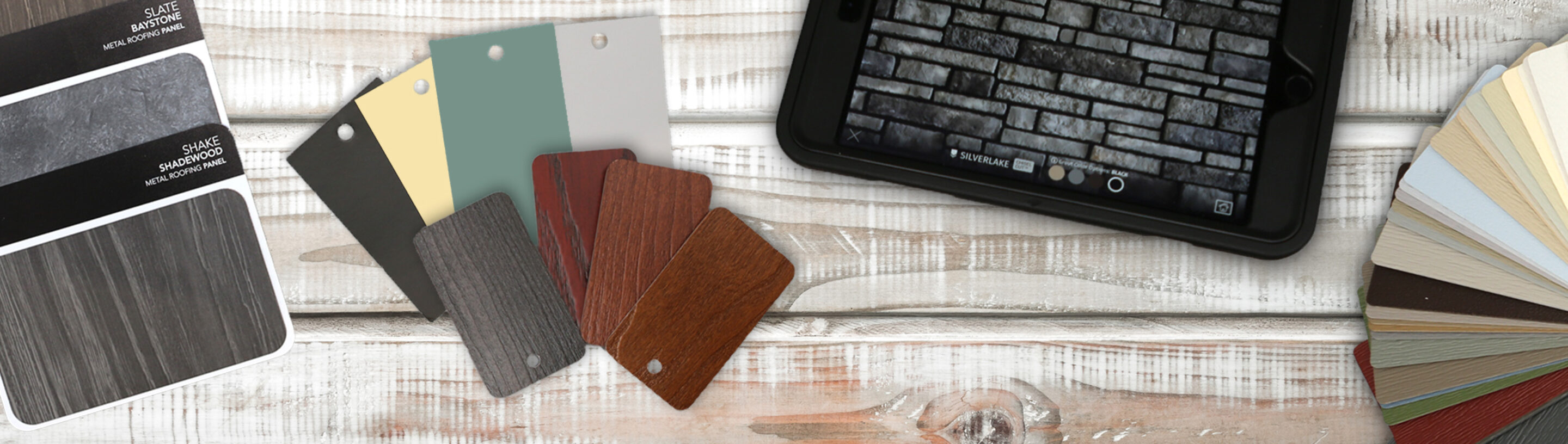 {ProVia color samples on a wooden surface showing ideas that can be put together for house color schemes}