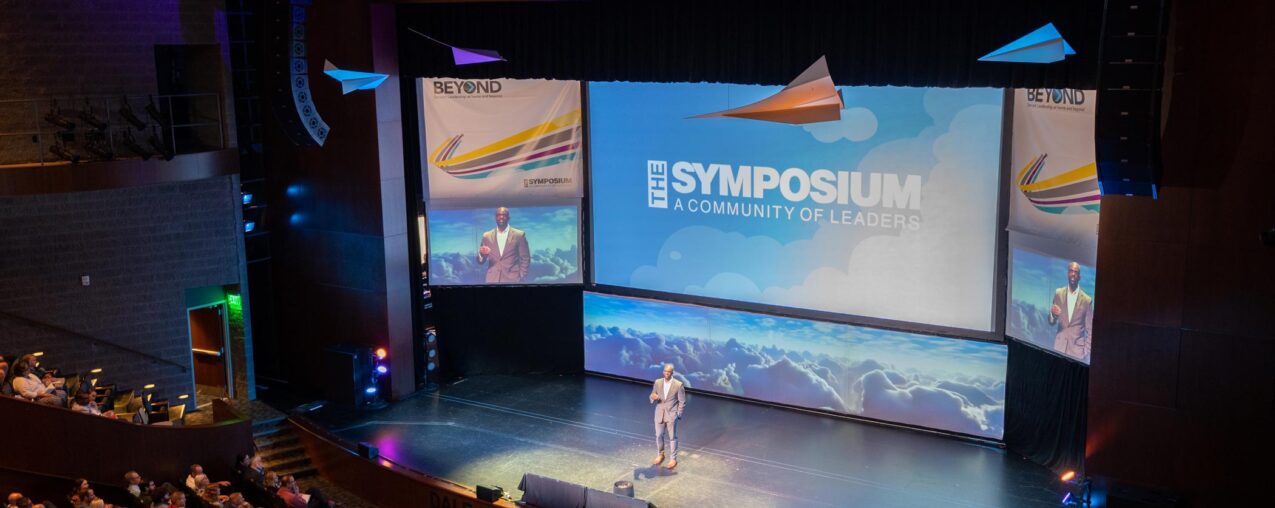 {Speaker Dan Owolabi at the 2022 Leadership Symposium, which provides leadership inspiration and insights}