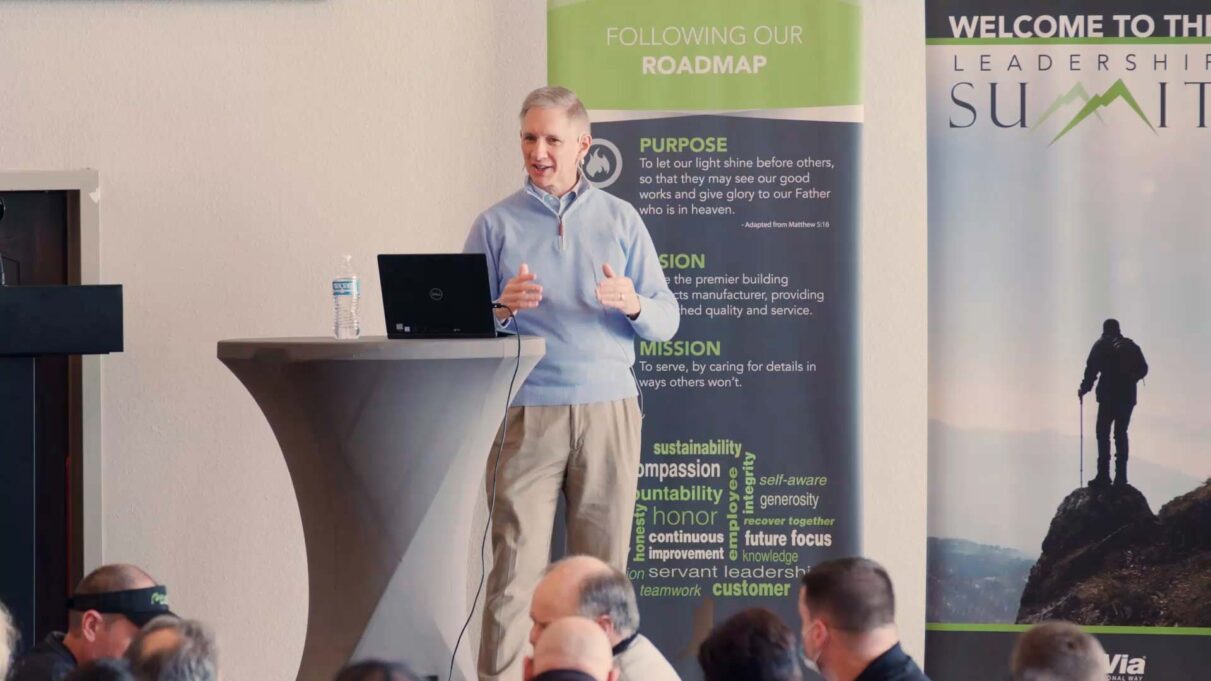{Brian Miller speaks at a recent Leadership Summit}