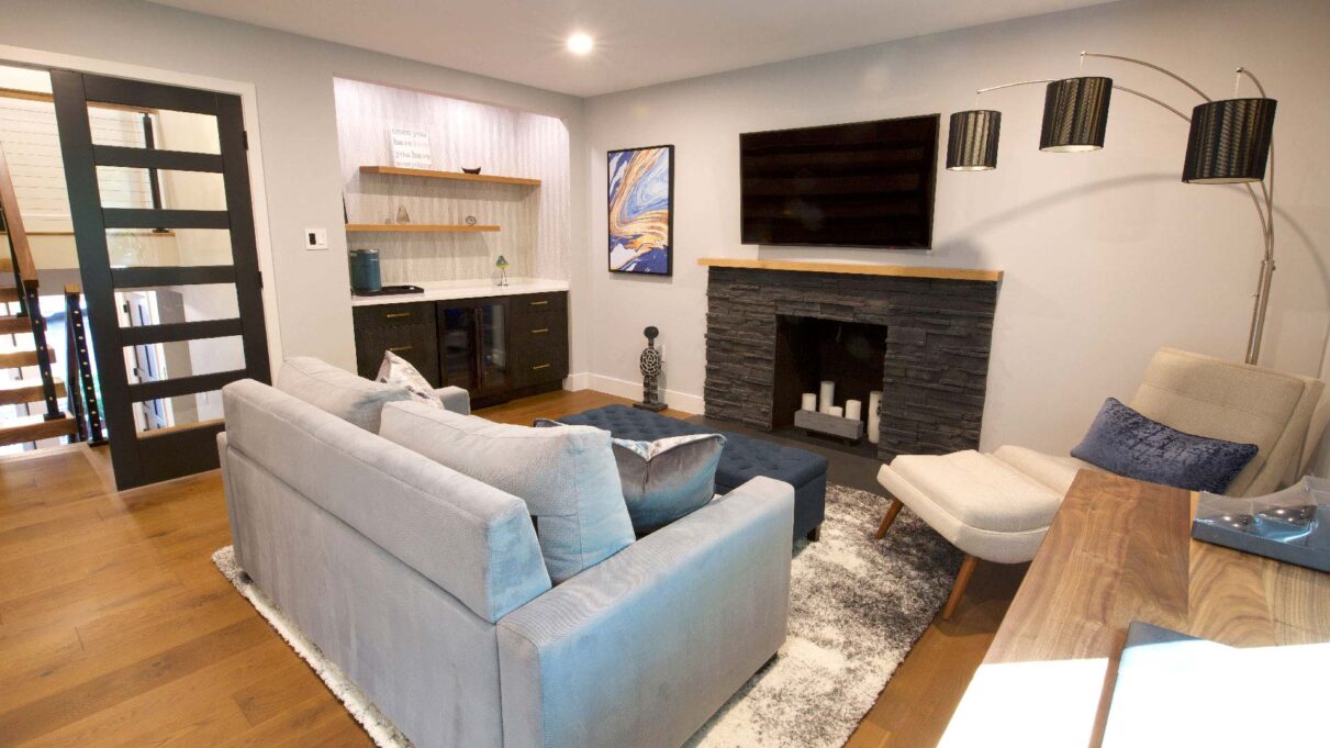 {ProVia's manufactured stone featured on stone fireplace inside remodeled home}