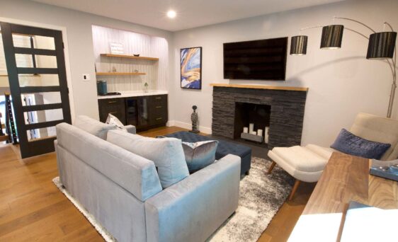 {ProVia's manufactured stone featured on stone fireplace inside remodeled home}