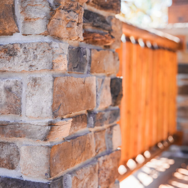 {ProVia Terra Cut manufactured stone on a porch column in the color Russet, example of how exterior stone for houses can be used}