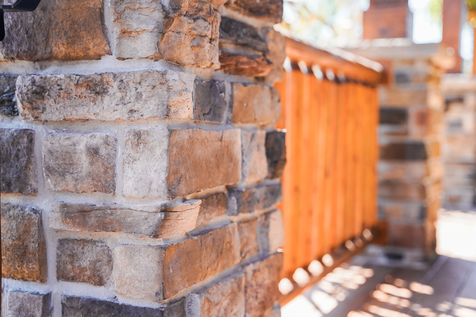 ProVia Terra Cut manufactured stone on a porch column in the color Russet, example of how exterior stone for houses can be used