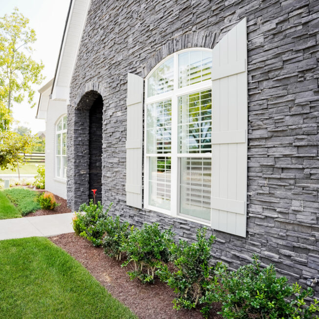 {PrecisionFit stack stone veneer in Sage Gray on a home's exterior}