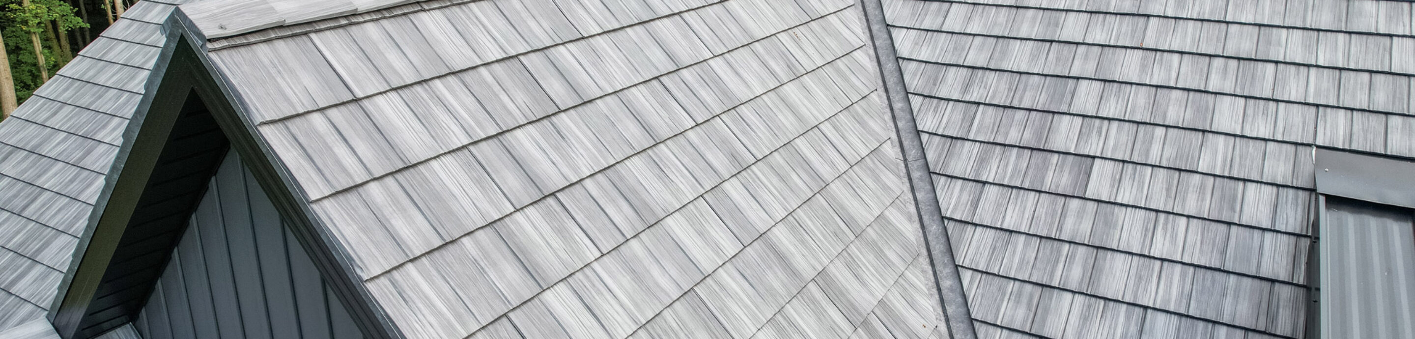 {Home with ProVia's gray Shadewood Shake metal shingle roof showing that metal roofing can resemble the look of shake shingles}