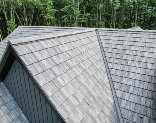 {Home with ProVia's gray Shadewood Shake metal shingle roof showing that metal roofing can resemble the look of shake shingles}