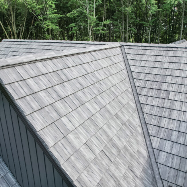 {Home with ProVia's gray Shadewood Shake metal shingle roof showing that metal roofing can resemble the look of shake shingles}