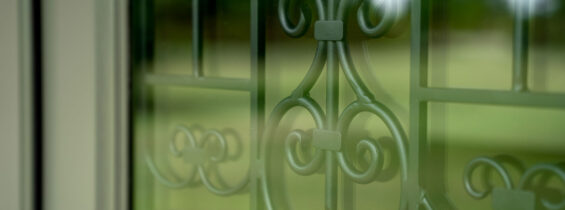 Barcelona Wrought Iron Design with Clear Glass on Legacy™ Smooth 440-2P Door in Antique