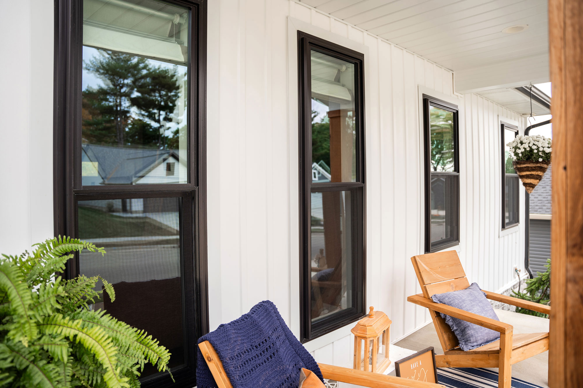 Endure™ Double Hung Windows in Textured Matte Coal Black on Front Porch