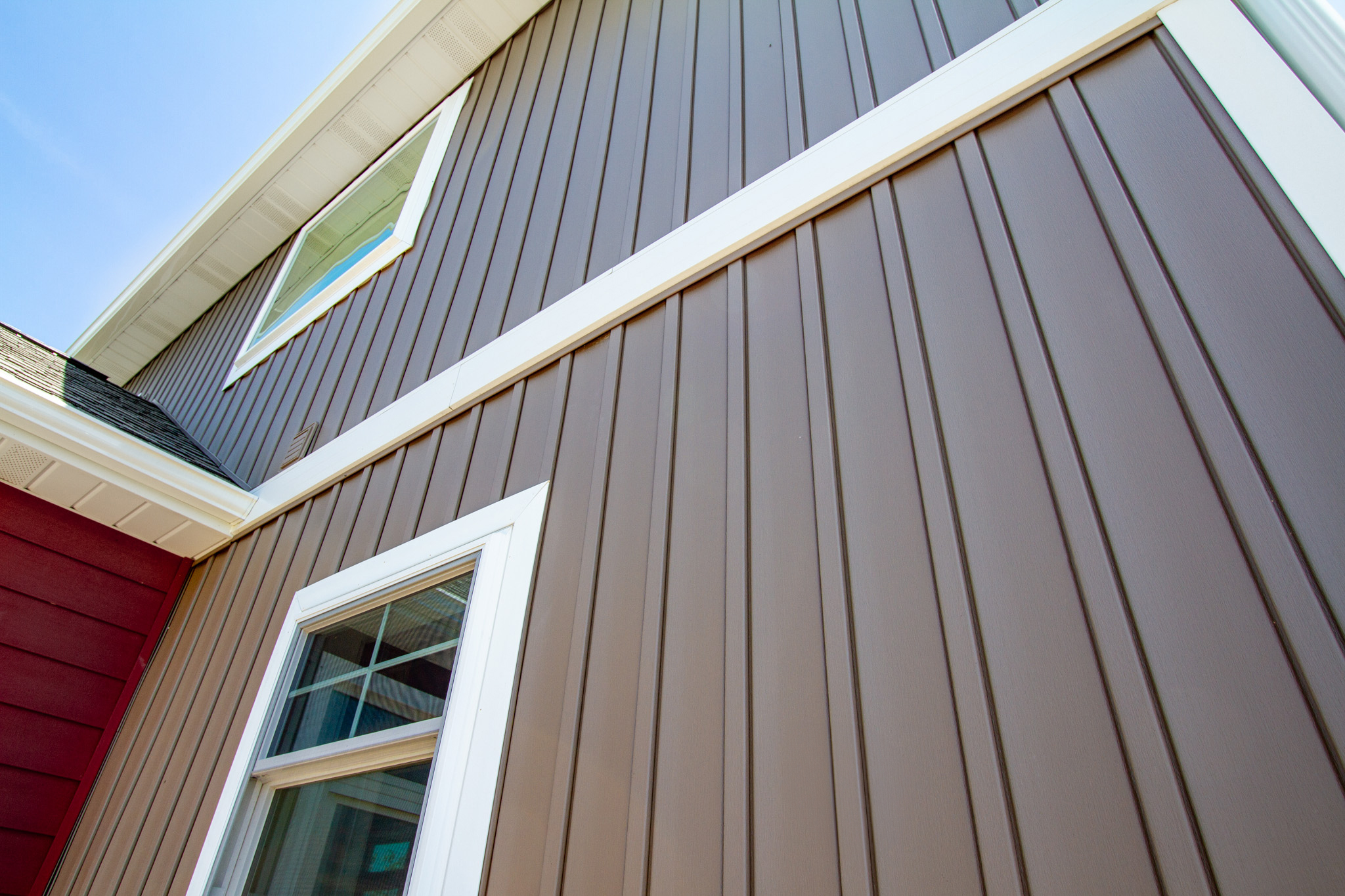 8" board and batten siding, also known as vertical siding, in the color Canyon