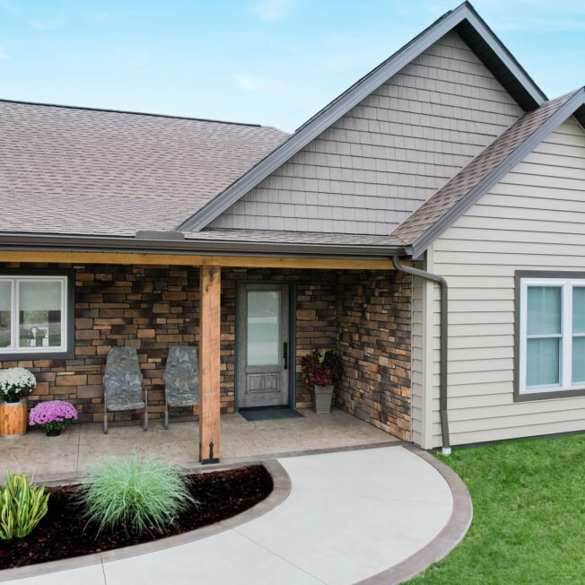 {ProVia Harbor Mill™ Shake and Shingle Siding in Pueblo with CedarMAX® Siding in Clay on a ranch home}