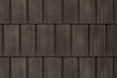 Closeup image showing the details of ProVia's Bronzewood dark brown colored shake metal shingle roof, example of metal roofing that looks like shake