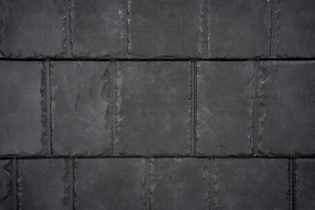Closeup image showing the details of ProVia's Coalstone dark gray colored metal slate roof 