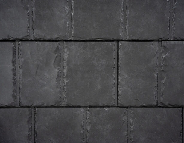 Closeup image showing the details of ProVia's Coalstone dark gray colored metal slate roof 