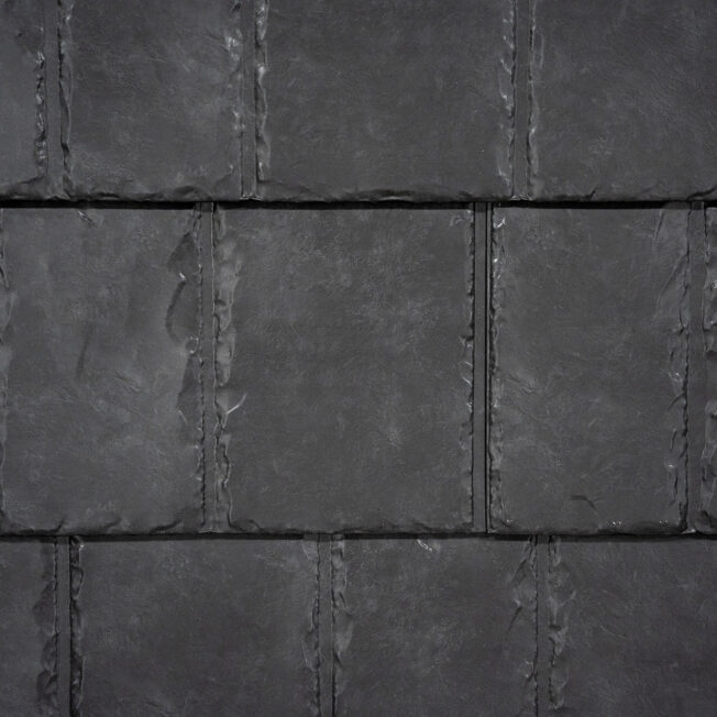 {Closeup image showing the details of ProVia's Coalstone dark gray colored metal slate roof }