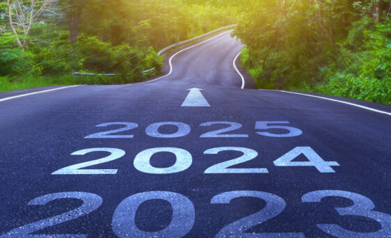 {Stock photo of a road illustrating looking ahead from 2024 to 2025 and beyond}