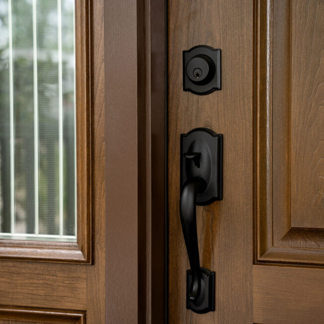 Closeup image of a ProVia Signet® Cherry 003 entry door in Natural Bark stain with Genesis Decorative Glass