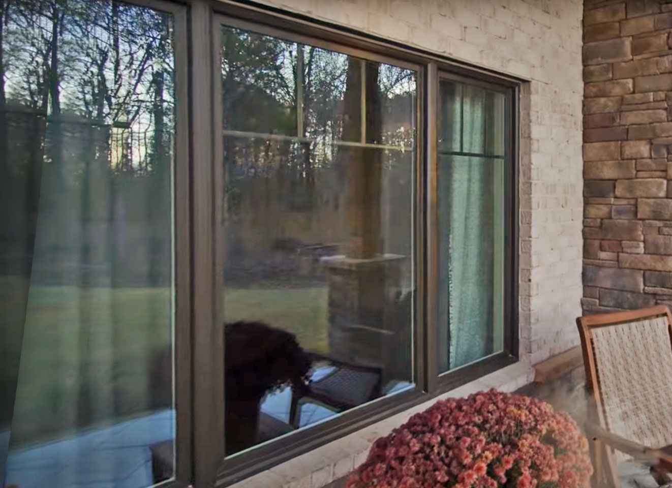 Closeup exterior image of ProVia Aeris™ Windows in Classic Bronze with Internal Grids