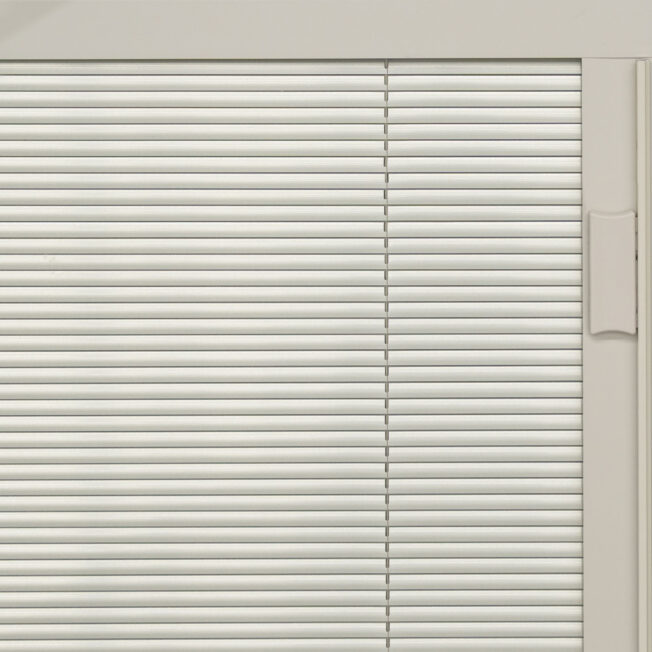 {Closeup view of exterior door with blinds in the color Champagne}