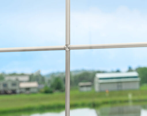 {Closeup view of pencil entry door grid option in the color Satin Nickel}