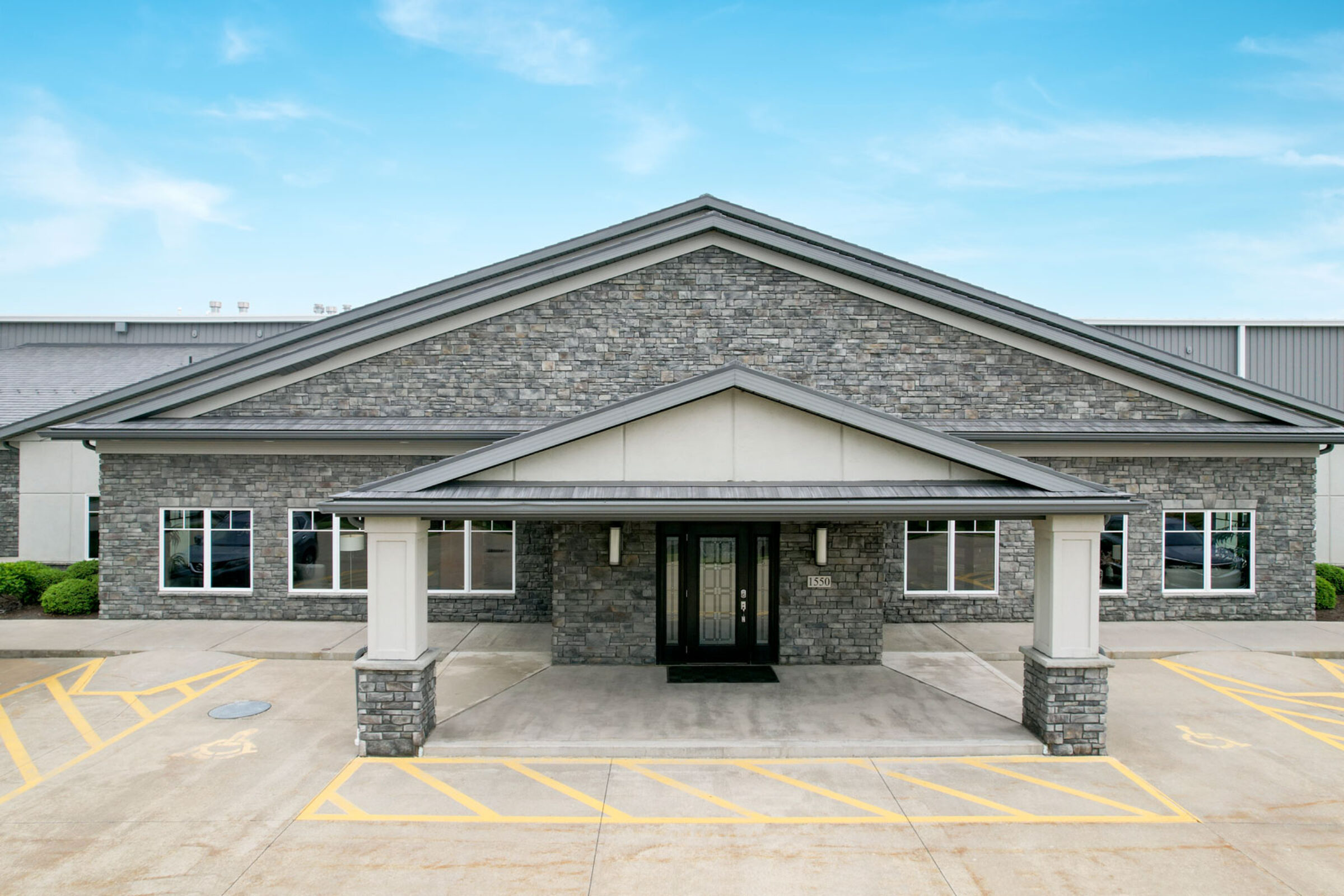 {Exterior view of the entrance of the ProVia® Cherry Ridge Manufactured Stone Facility}