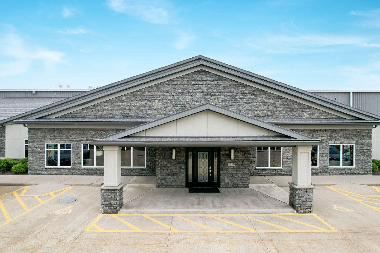 Exterior view of the entrance of the ProVia® Cherry Ridge Manufactured Stone Facility