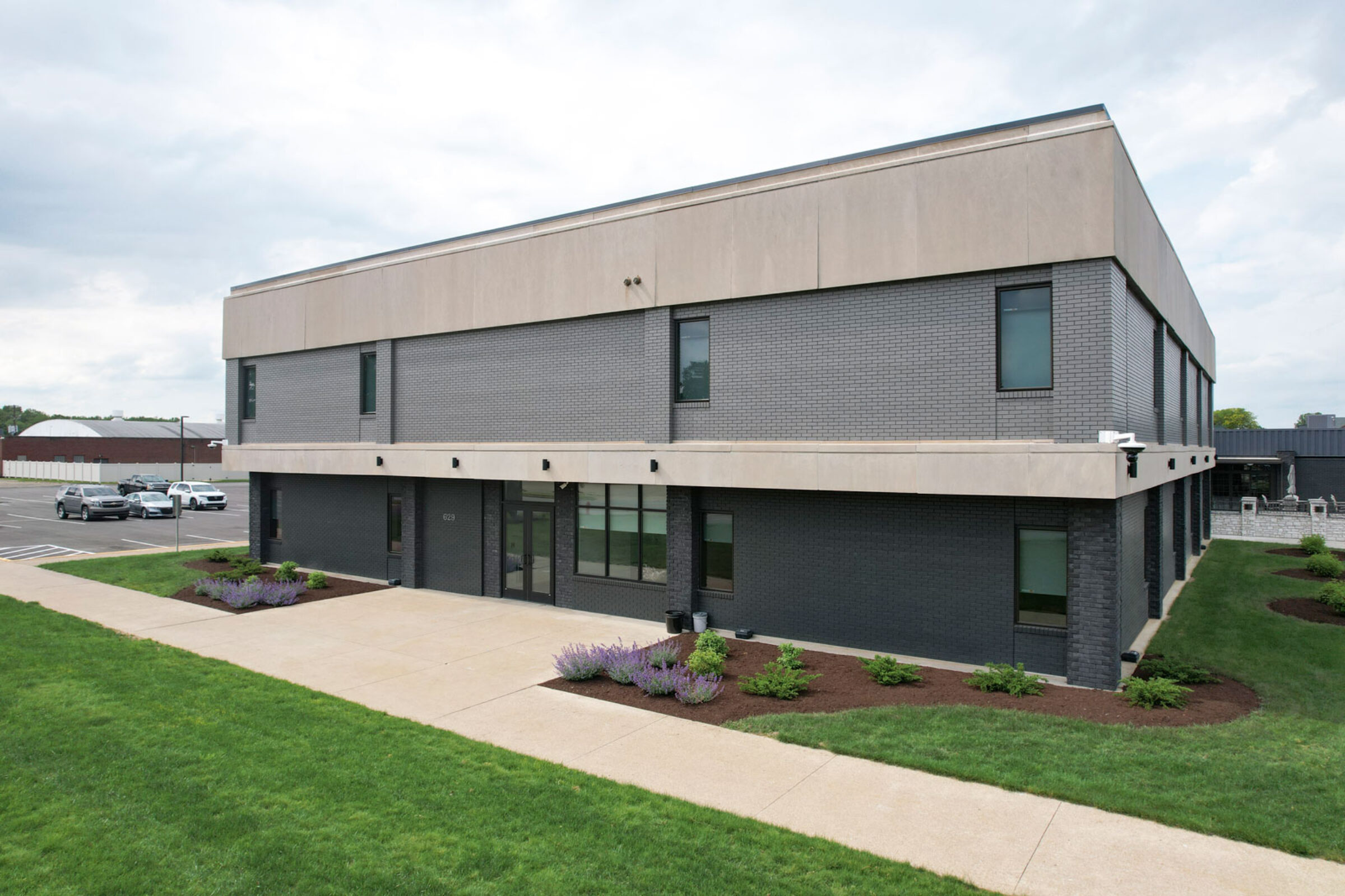 {Exterior view of the entrance of the ProVia® New Philadelphia Facility, where window and patio door profile lamination is produced}