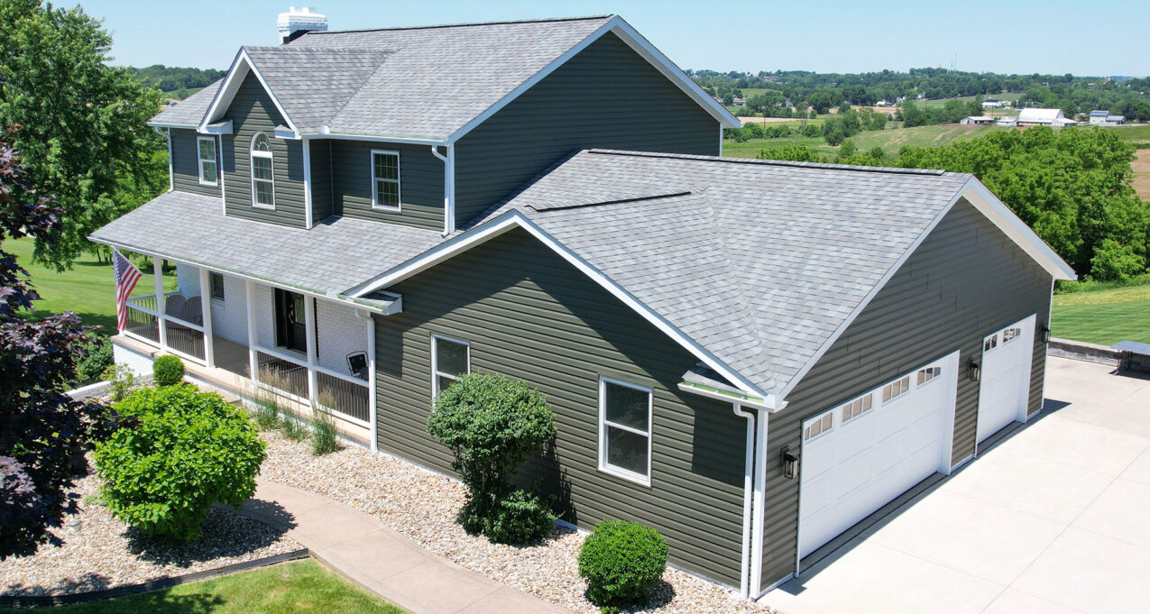 {HeartTech dark green vinyl siding in the color Pine}