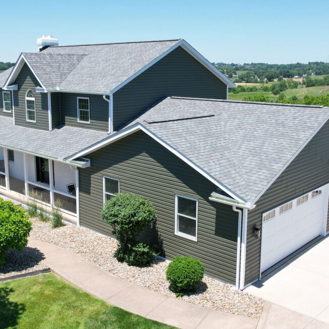 {HeartTech dark green vinyl siding in the color Pine}