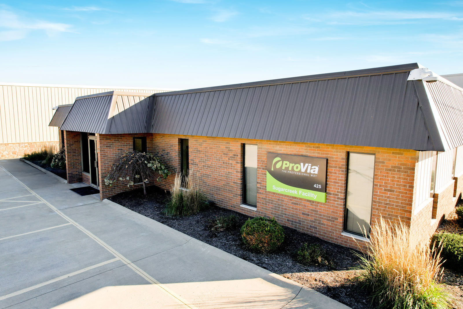 Exterior view of the entrance of the ProVia® Sugarcreek Storm & Patio Door Production Facility