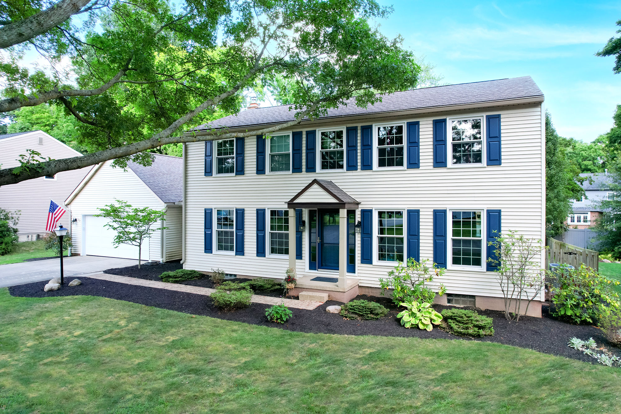 Endure™ Double Hung Windows in White on a Colonial-Style Home