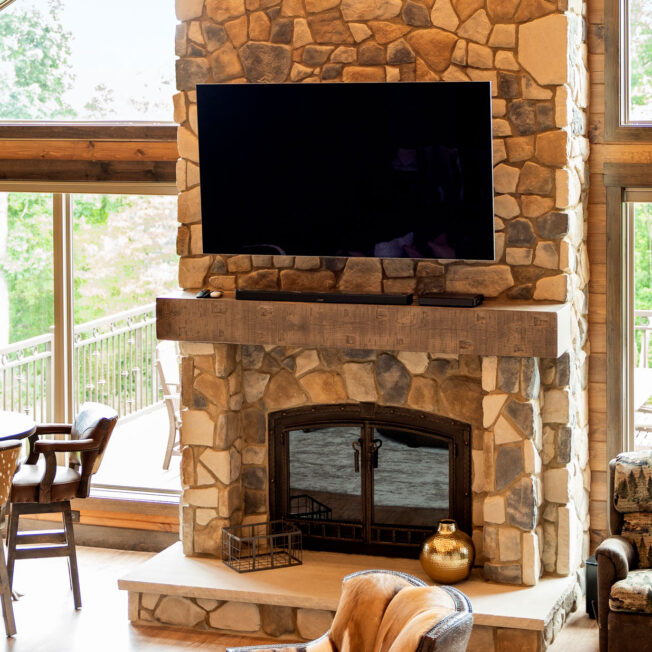 {ProVia Fieldstone Manufactured Stone Fireplace in the color Strathmore in a rustic home}