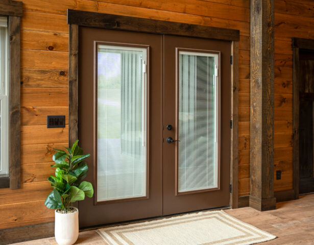 {Home exterior with ProVia Legacy™ 460 Steel French Doors in Tudor Brown with Internal Blinds}