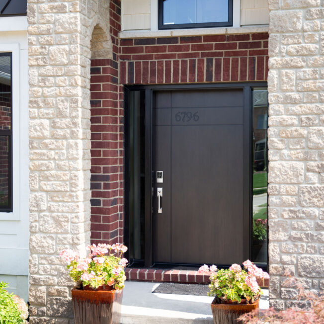 {Exterior view of a ProVia Signet® Cherry 001-INS3-HN Inscribed front Door in Coffee Bean stain}