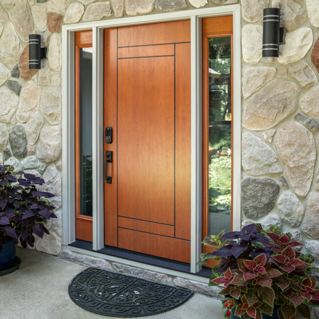 {Exterior view of a ProVia Signet® Cherry 001-INS5 Inscribed entry door in Toffee stain}