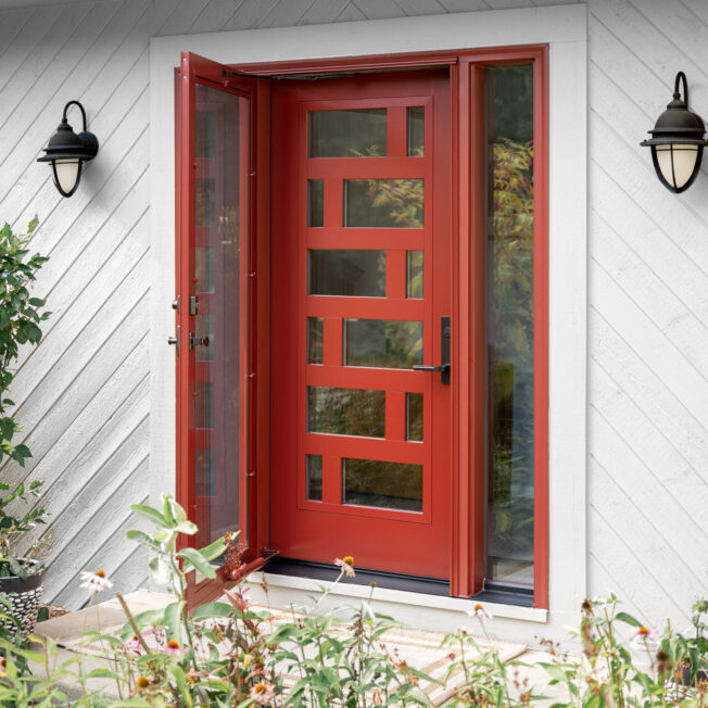 {Exterior image of a ProVia Signet® Smooth 460-M3 modern entry door in Mountain Berry with a 770 Sidelite}