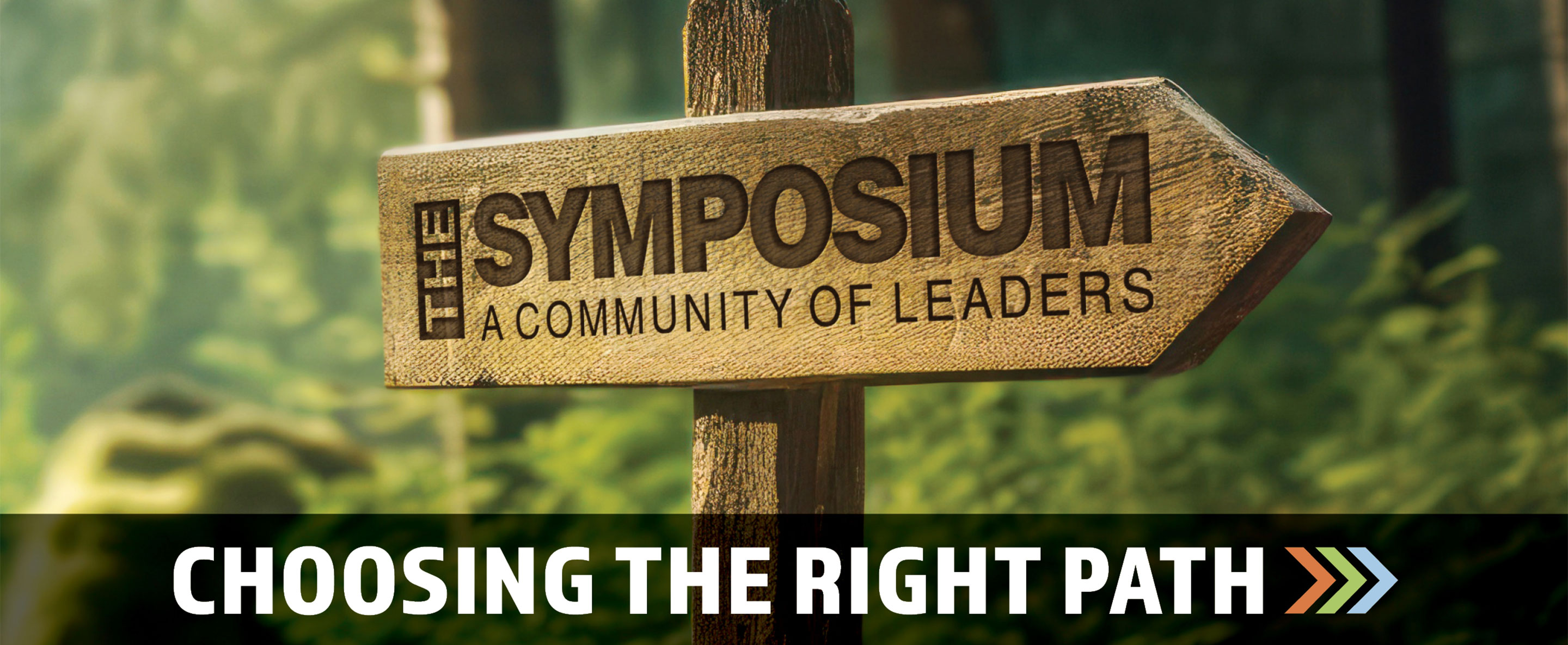 Wooden sign that says, "Symposium—A Community of Leaders," which is the featured image for the 2025 Leadership Symposium in New Philadelphia, Ohio