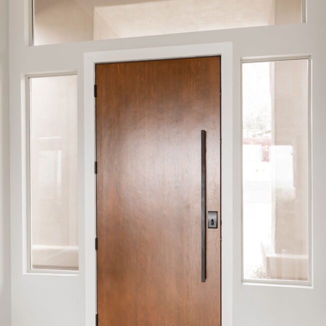 Interior view of a ProVia® Signet® Cherry 001 8' 42" Wide entry door in Nutmeg with an Emtek® Square Pull Bar in Black