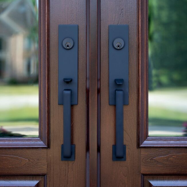 Closeup image of Emtek® Davos Entry Door Hardware in Black on a ProVia® entry door