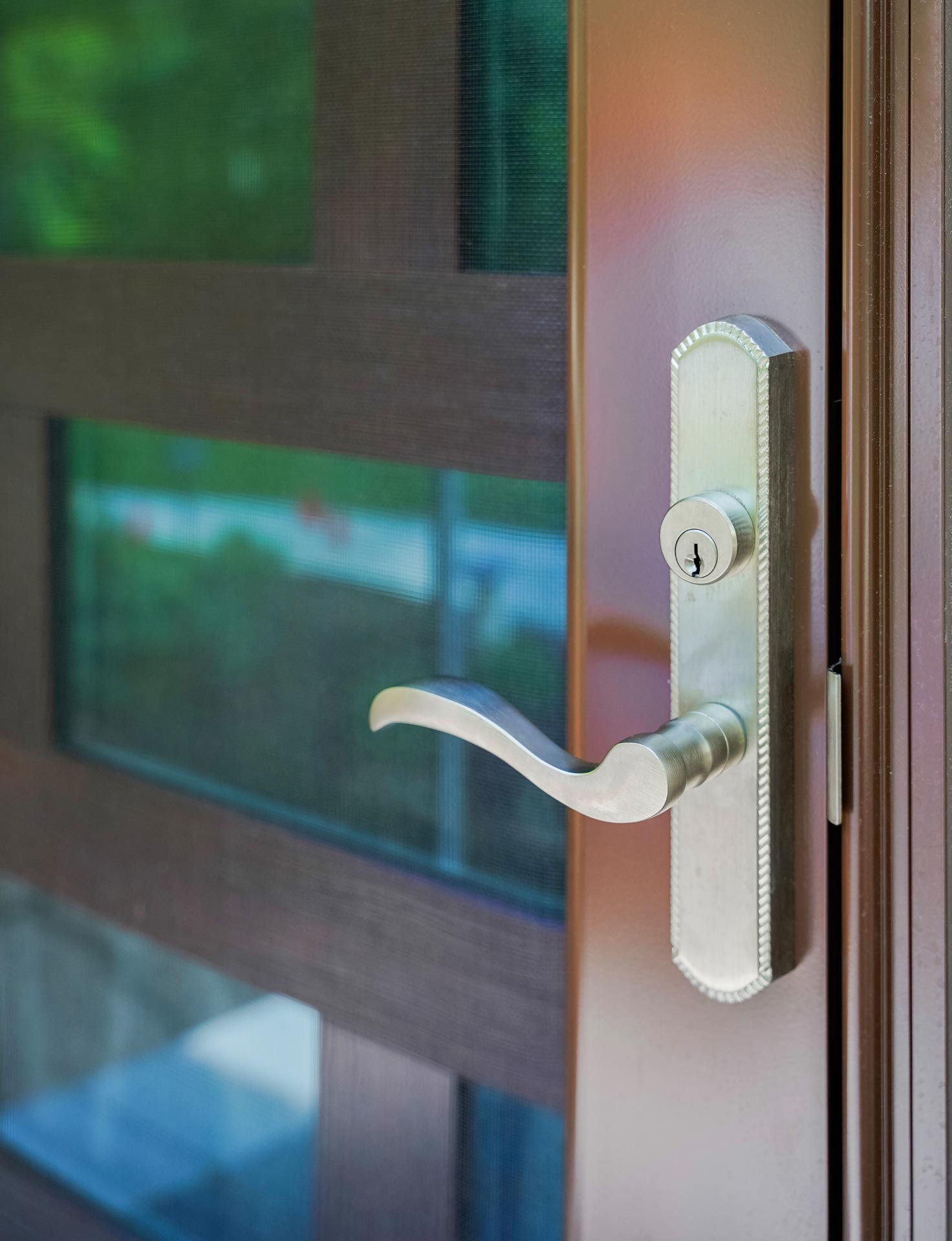 Mortise Multi-Point Sierra Storm Door Hardware in Satin Nickel on a ProVia® Tudor Brown storm door
