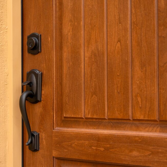 Closeup of Schlage® Camelot Entry Door Hardware in Black on a ProVia® entry door