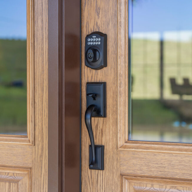 Closeup of Schlage® Addison Entry Door Hardware with Electronic Keypad Deadbolt in Black on a ProVia® front door